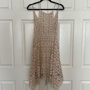 Free people beige  lace dress size 6 handkerchief hem, just above the knees